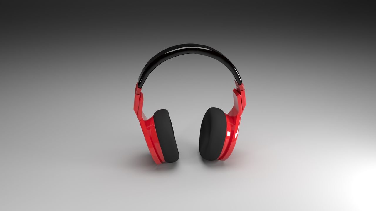 Vibrant red headphones isolated on a smooth gray gradient background, perfect for music and technology themes.